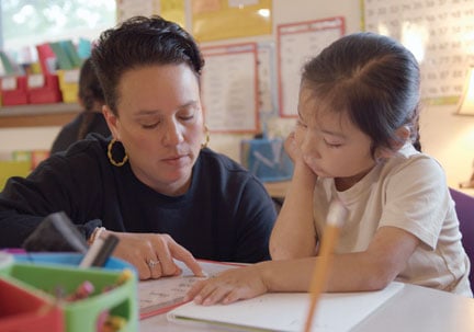 Teacher with student at Sapa Un Jesuit Academy